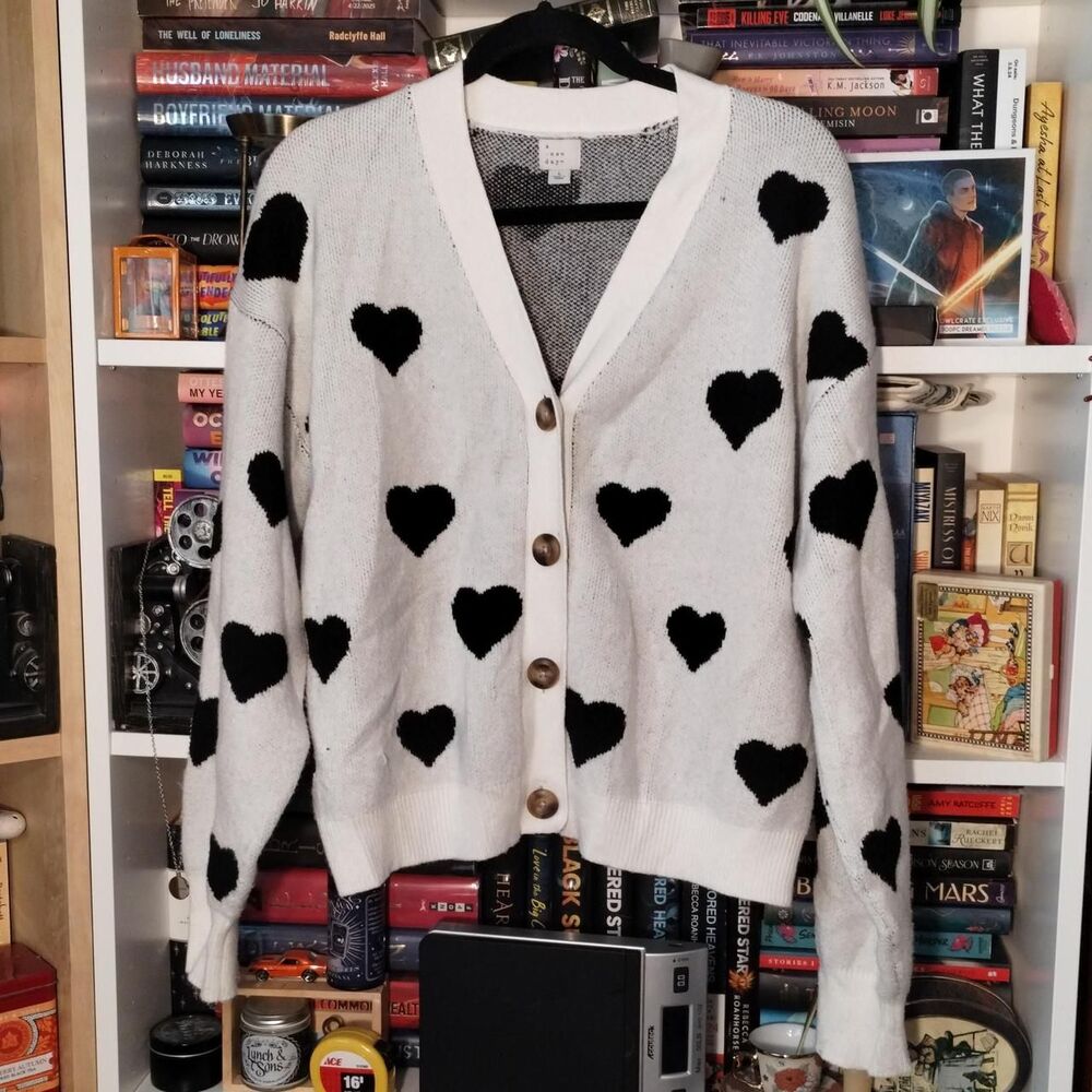 A New Day white cardigan with black heart pattern